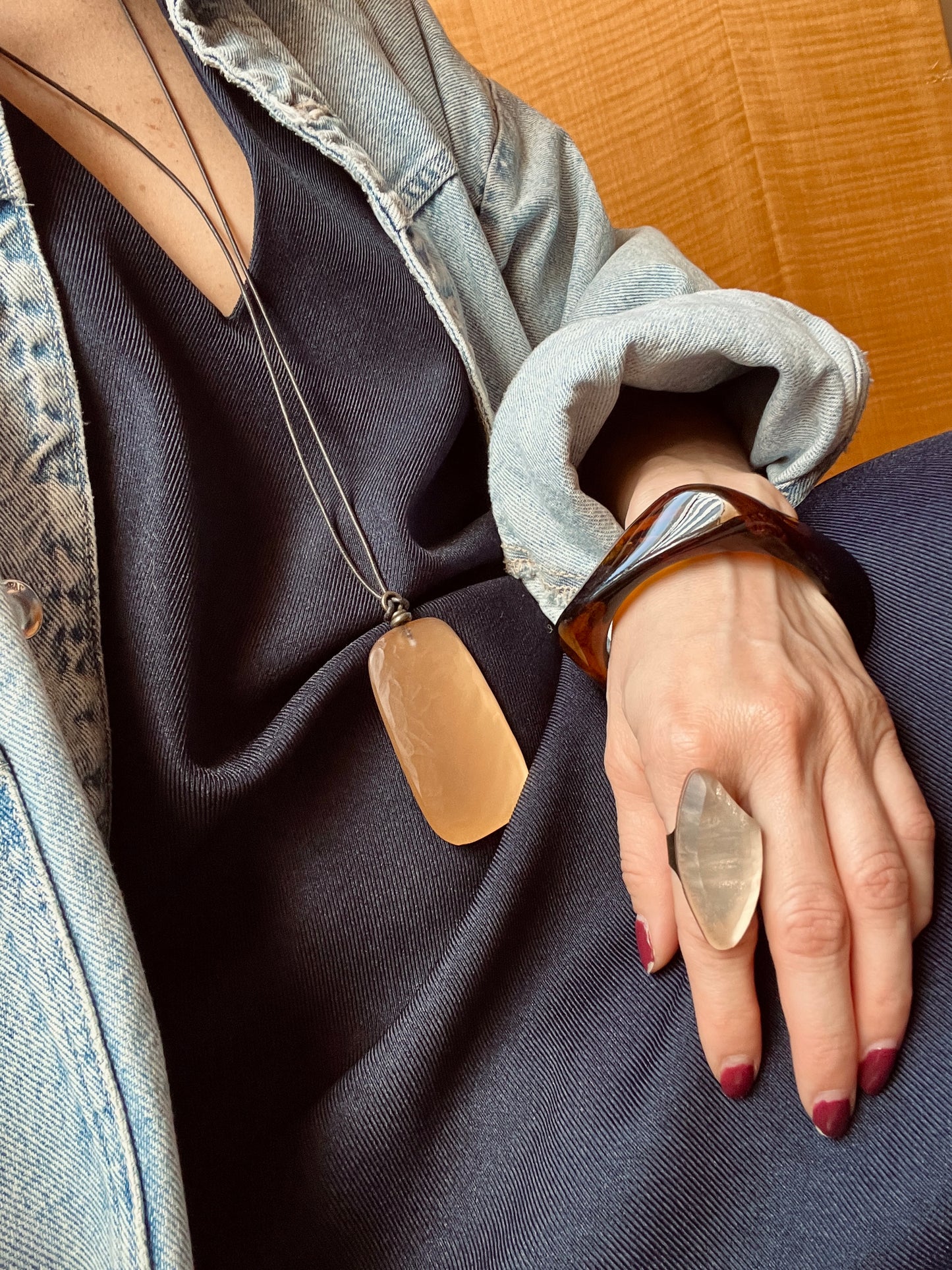 Adjustable leather and resin pendant